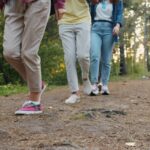 늘어나는 ‘걷기 챌린지’, 꾸준함이 만드는 건강한 변화 Group of people walking on a forest path