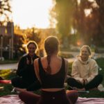 여성 건강관리, 일상에서 실천하는 새로운 트렌드 a group of people sitting on top of a lush green field
