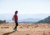 ‘걷기 명상’ 열풍, 건강·마음 챙기기의 새로운 생활 루틴으로 자리잡다 a man with a backpack walking across a dry grass covered field